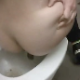 A girl records herself taking a shit in a public restroom. The camera work is shaky, but we get to see her shit coming out and the wiping afterwards.